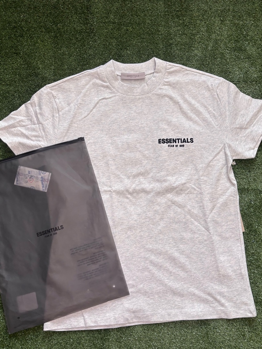 Fear of God Essentials Short Sleeve T-Shirt in Light Gray with Black Logo